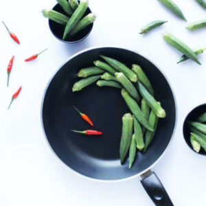 Okra and red chilies on a frying pan. Photo by DreamPix Photography on pexels.com.